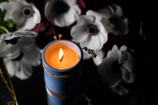 Beeswax candle in ceramic jar