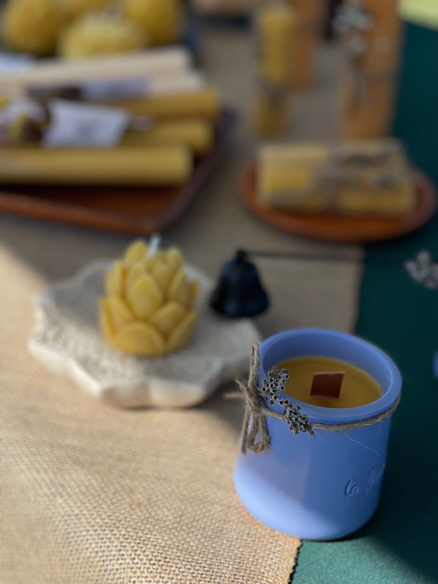 Beeswax candle in ceramic jar